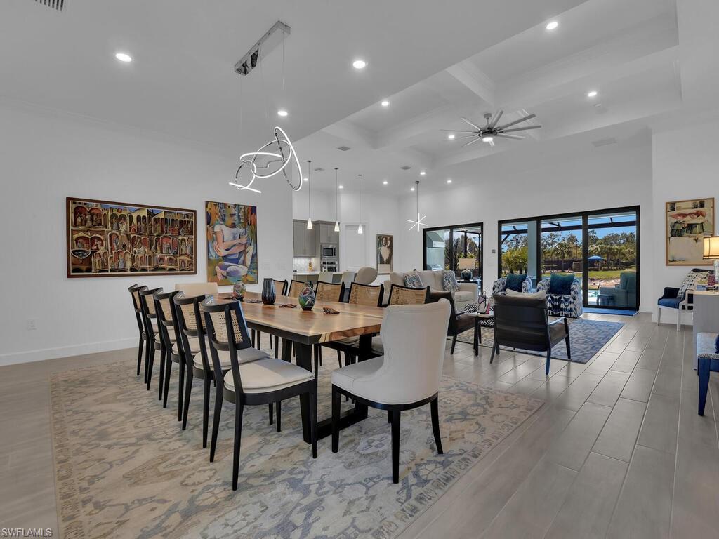 7229 Wiregrass Court Naples, FL 34114 - Photo 6 of 40 a view of a dining room with furniture window and wooden floor