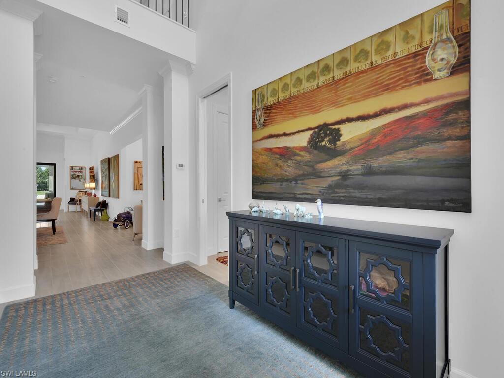 7229 Wiregrass Court Naples, FL 34114 - Photo 10 of 40 a view of a living room and a window