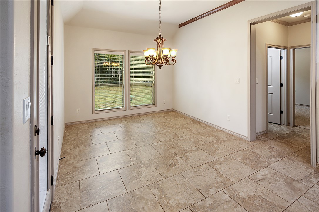 4662 Hidden Springs Way College Station, TX 77845 - Photo 15 of 48 a view of an empty room with window and chandelier
