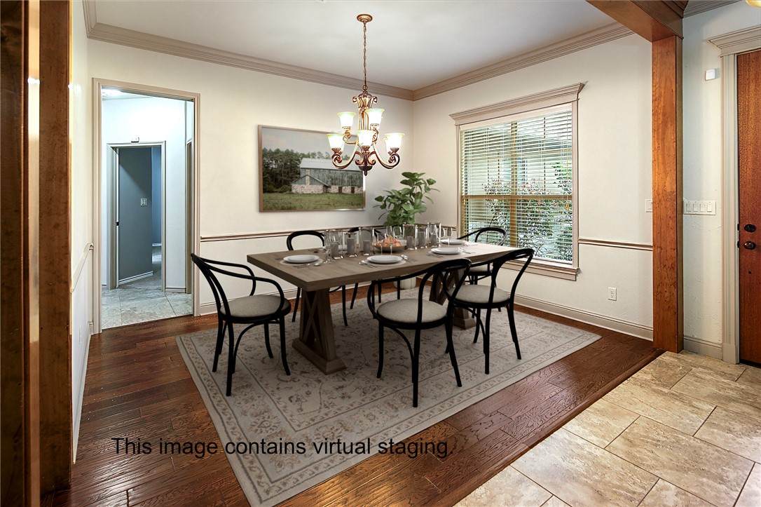 4662 Hidden Springs Way College Station, TX 77845 - Photo 16 of 48 a dining room with furniture a chandelier and wooden floor