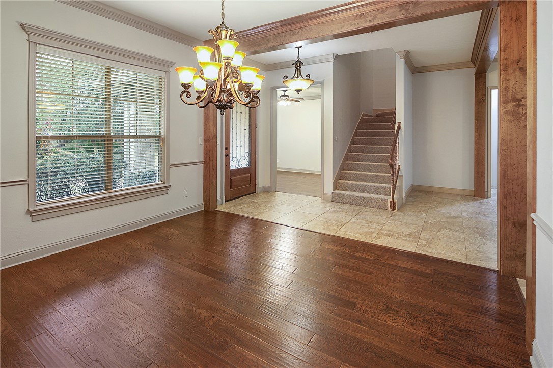4662 Hidden Springs Way College Station, TX 77845 - Photo 18 of 48 wooden floor in an empty room with a window