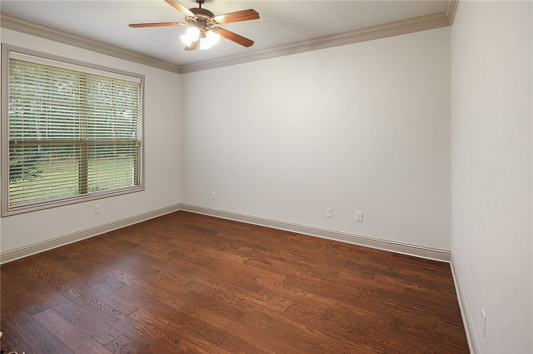4662 Hidden Springs Way College Station, TX 77845 - Photo 19 of 48 wooden floor in an empty room with a window