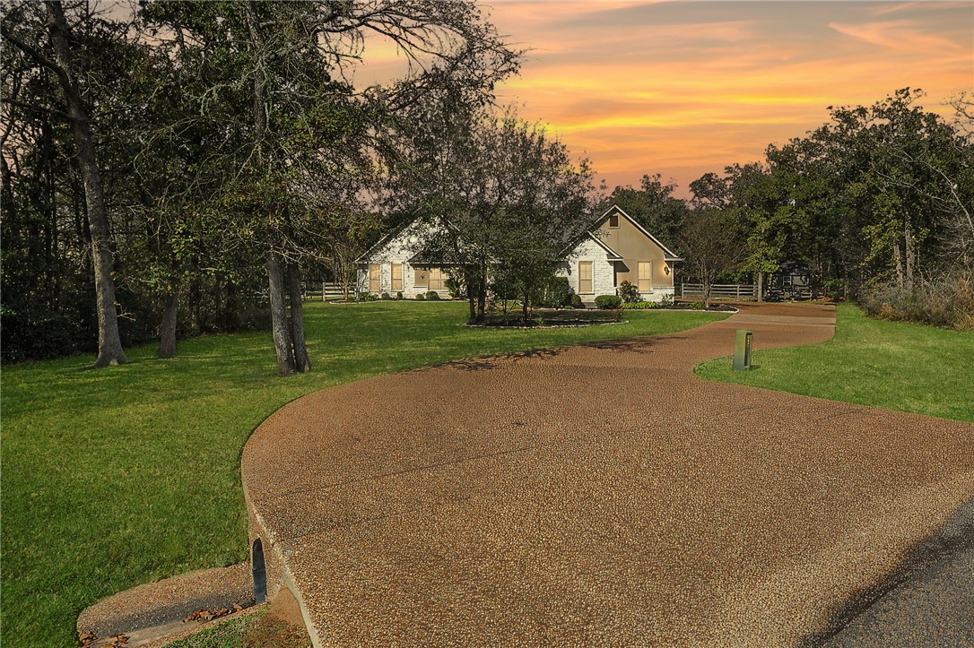 4662 Hidden Springs Way College Station, TX 77845 - Photo 2 of 48 a front view of a house with a yard