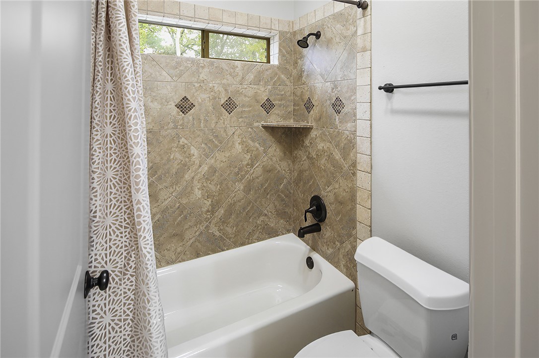 4662 Hidden Springs Way College Station, TX 77845 - Photo 30 of 48 a bathroom with a toilet and a bathtub