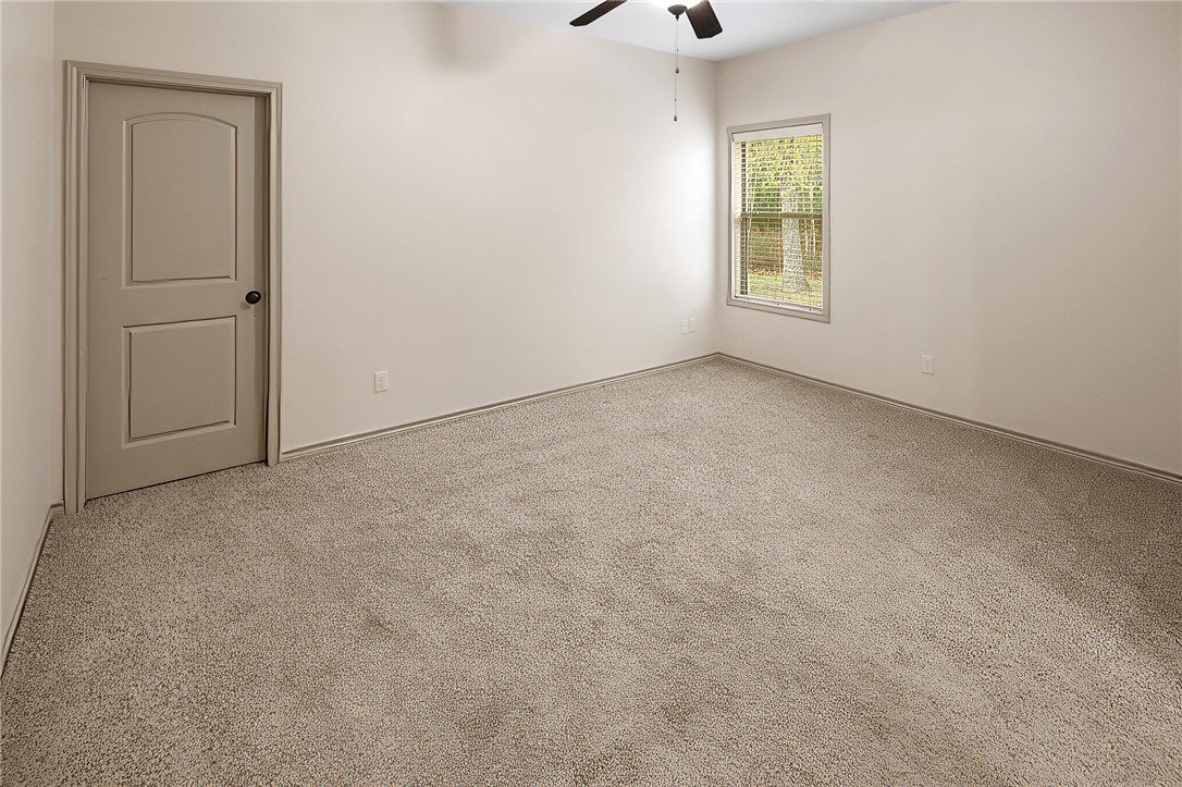 4662 Hidden Springs Way College Station, TX 77845 - Photo 31 of 48 an empty room with windows and closet