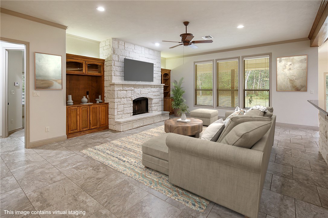 4662 Hidden Springs Way College Station, TX 77845 - Photo 6 of 48 a living room with furniture and a fireplace