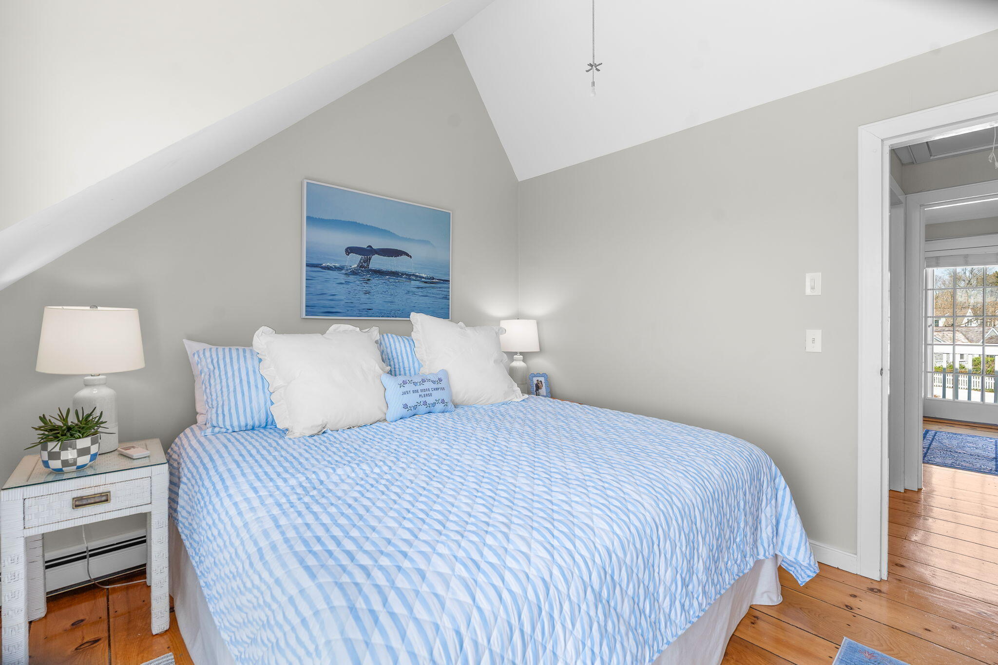 4 Race Point Road, Unit 4 Mashpee, MA 02649 - Photo 25 of 43 a bedroom with a bed and a lamp on dresser