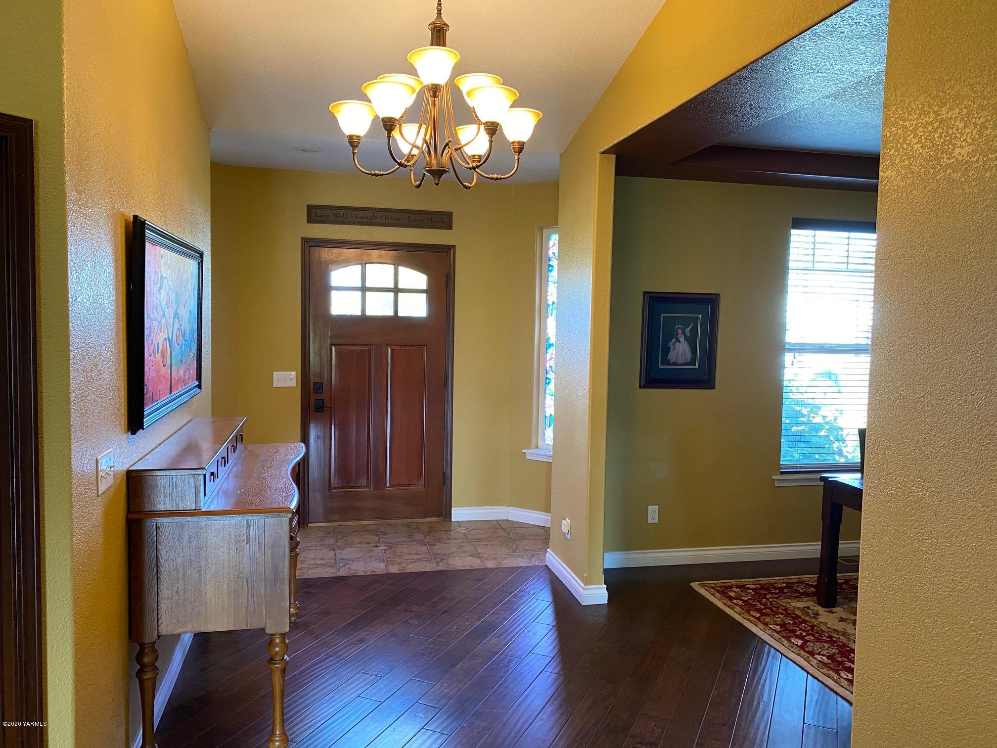 3365 Waneta Road Grandview, WA 98930 - Photo 11 of 35 a view of a livingroom with wooden floor and windows