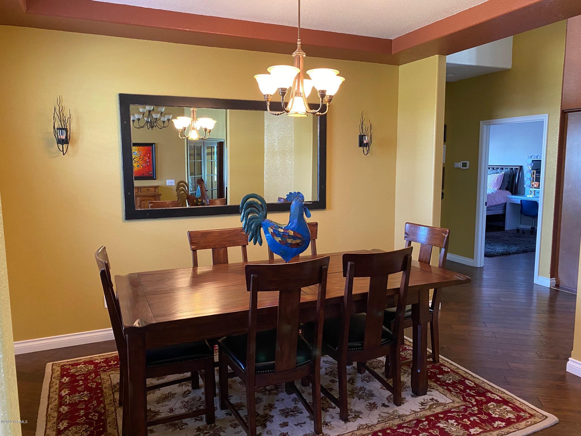 3365 Waneta Road Grandview, WA 98930 - Photo 17 of 35 a dining room with furniture and wooden floor