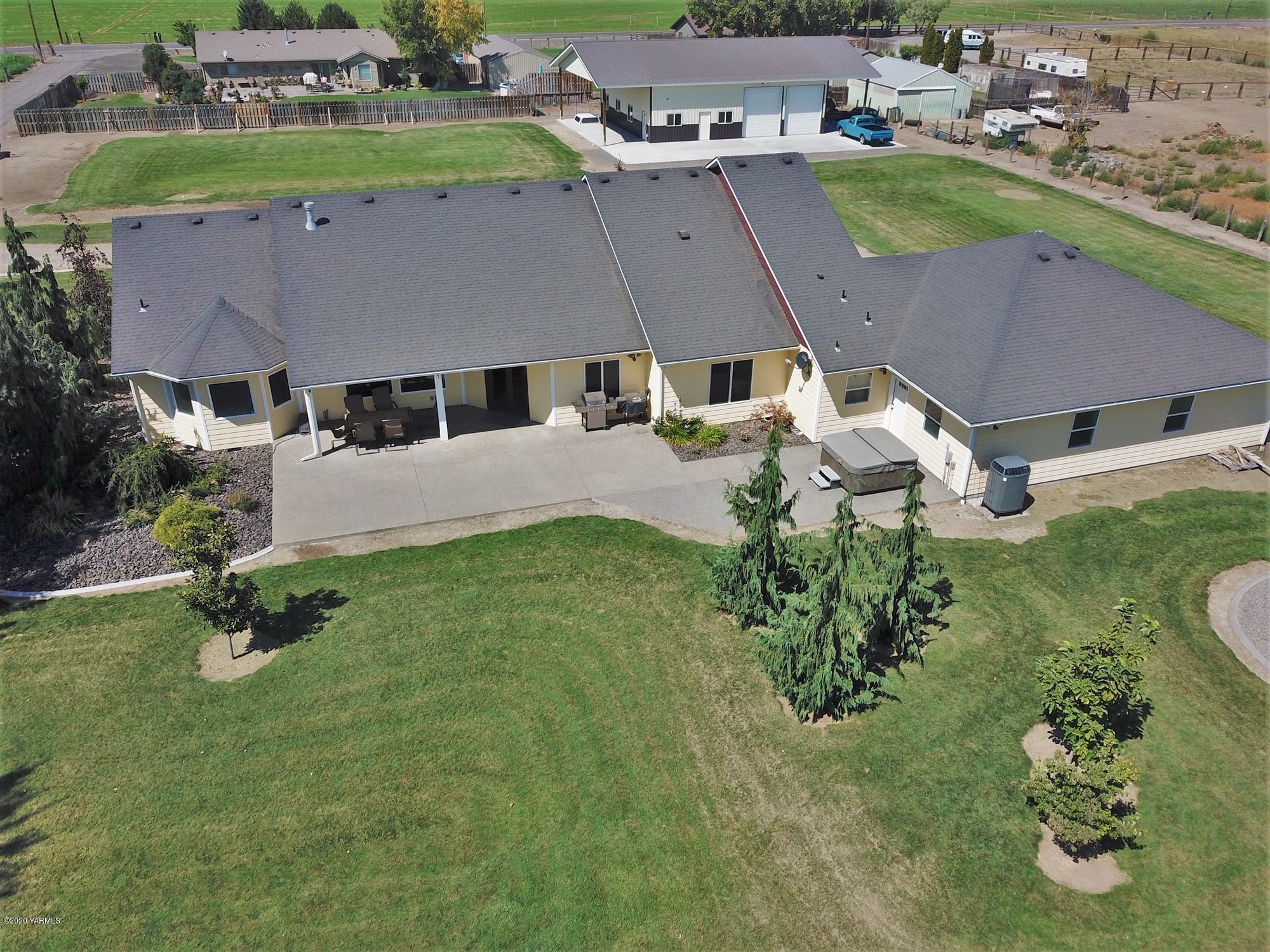 3365 Waneta Road Grandview, WA 98930 - Photo 5 of 35 an aerial view of a house with garden space and street view