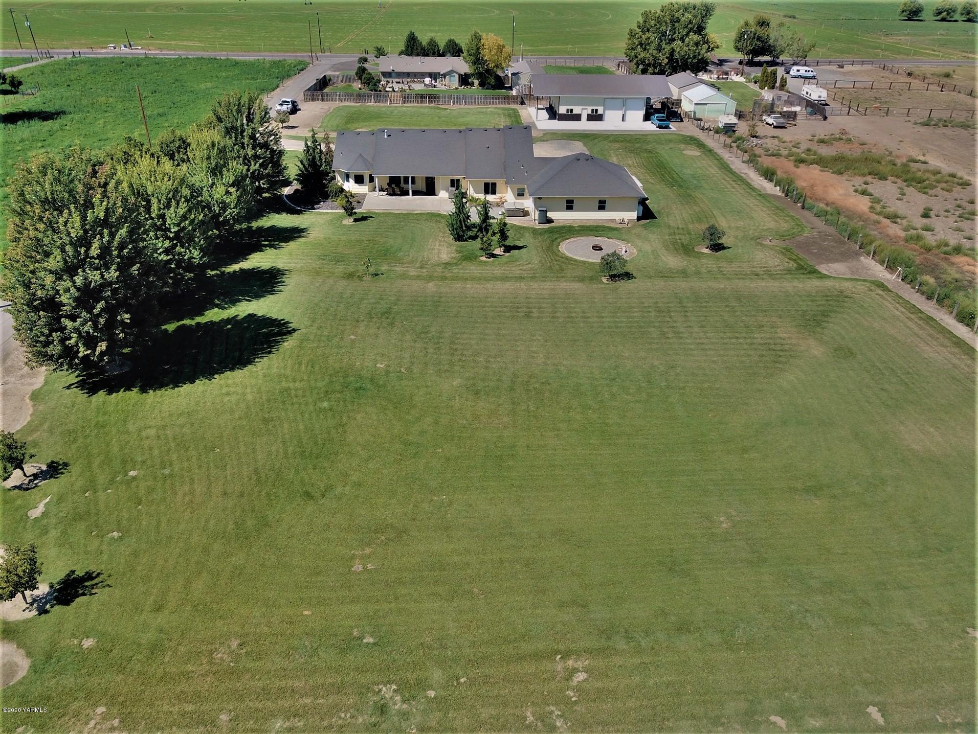3365 Waneta Road Grandview, WA 98930 - Photo 6 of 35 a view of a lake with a house