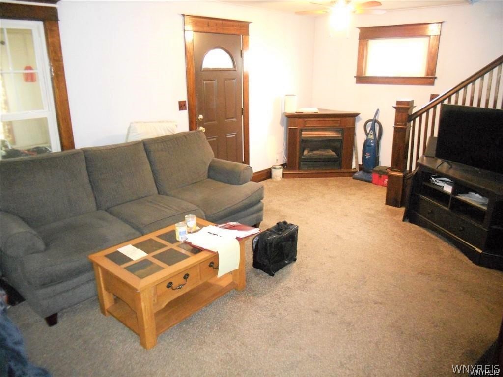 7041 Maple Road Alabama, NY 14013 - Photo 28 of 50 Propane fireplace in corner stays with the house.