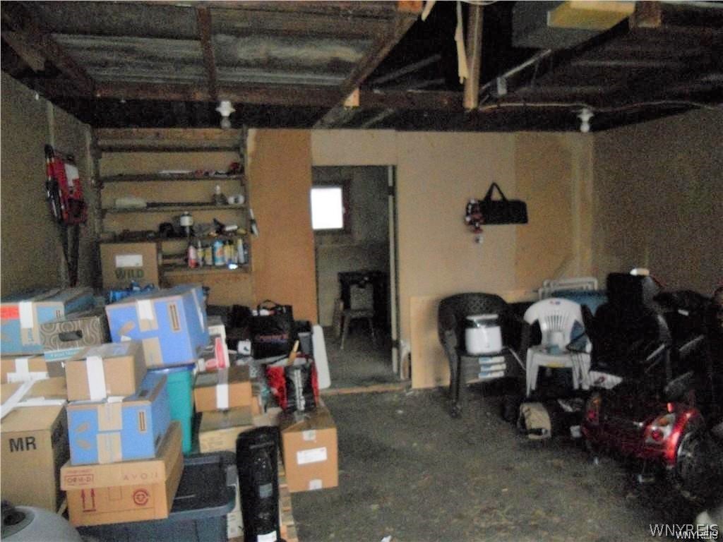 7041 Maple Road Alabama, NY 14013 - Photo 42 of 50 Large 1 1/2 car garage with shop in back.