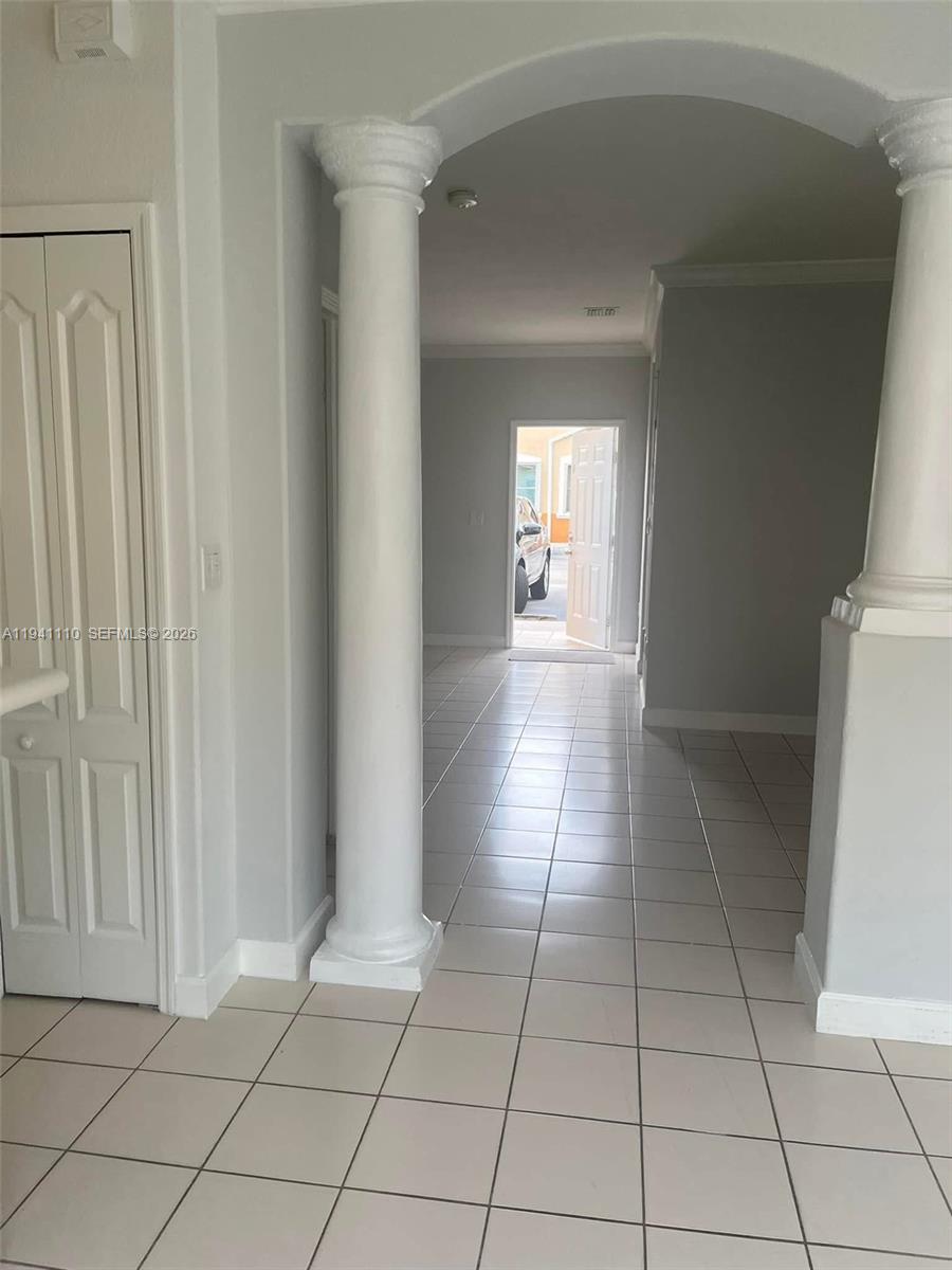 7325 Northwest 174th Terrace, Unit 104 Hialeah, FL 33015 - Photo 8 of 10 a view of a livingroom with an empty space and a window