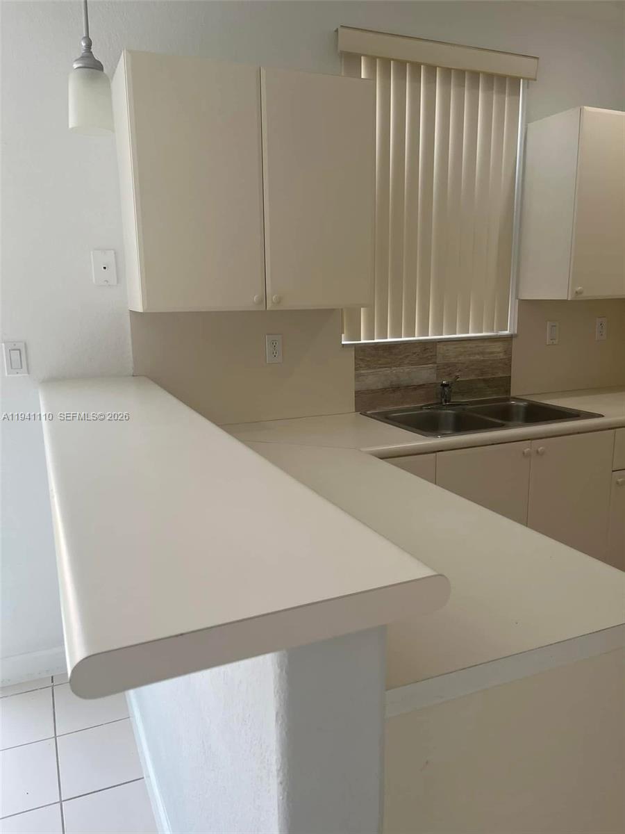 7325 Northwest 174th Terrace, Unit 104 Hialeah, FL 33015 - Photo 10 of 10 a view of a kitchen with a sink