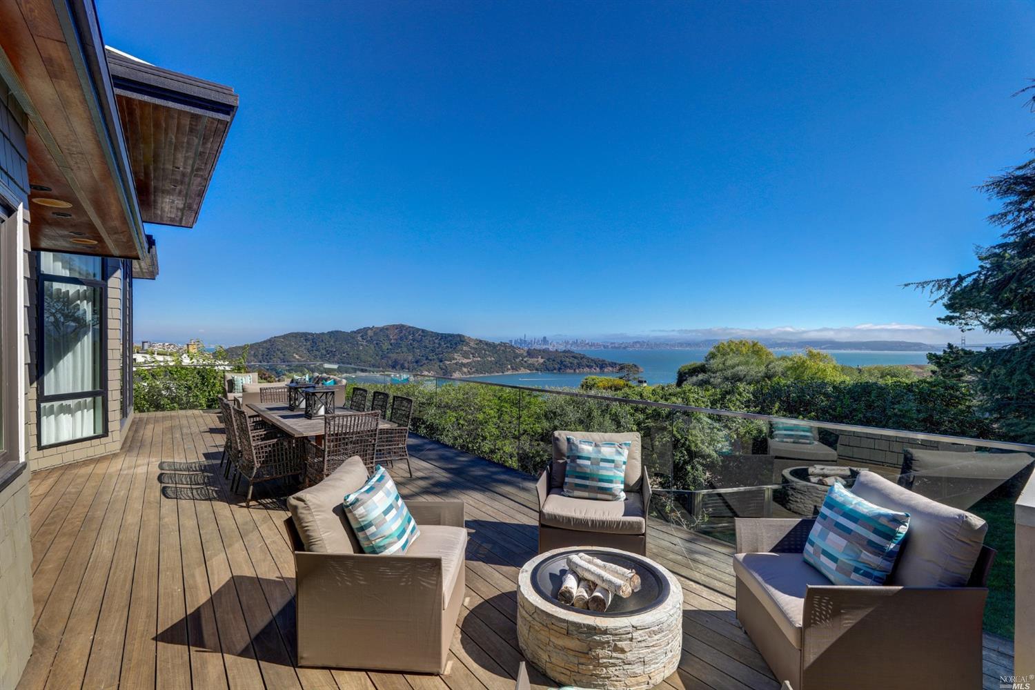 616 Ridge Road Tiburon, CA 94920 - Photo 1 of 1 a view of a roof deck with couches and a fire pit