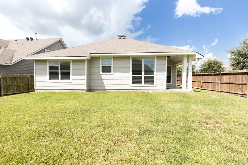 1001 Rootstock Rd. Brenham, TX 77833 - Photo 28 of 28 a view of a house with a backyard and yard