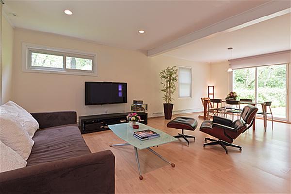 66 Munroe Road Lexington, MA 02421 - Photo 1 of 15 a living room with furniture a large window and a flat screen tv