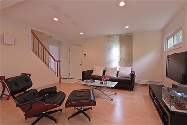 66 Munroe Road Lexington, MA 02421 - Photo 2 of 15 a living room with furniture and a flat screen tv