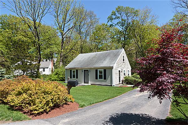 66 Munroe Road Lexington, MA 02421 - Photo 6 of 15 a front view of a house with a garden