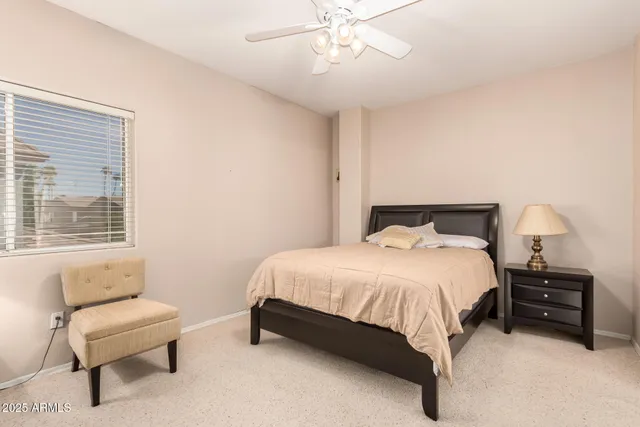 a bedroom with a bed and a couch