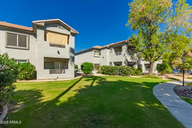 a front view of a house with a yard table and chairs