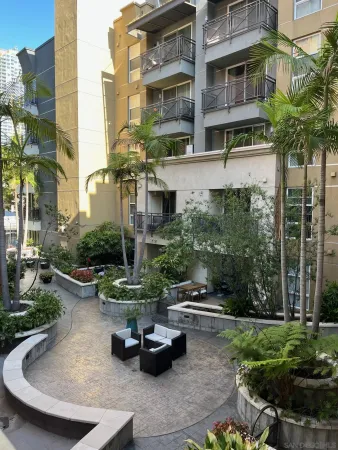 a living room with furniture fireplace and flat screen tv