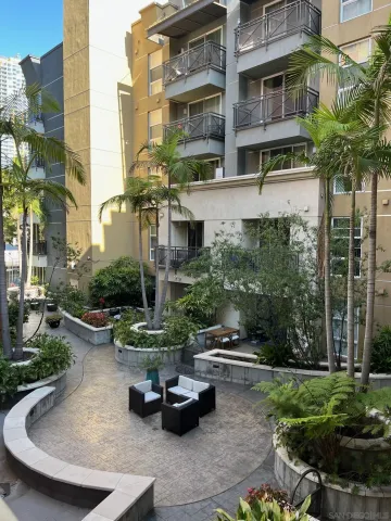 a living room with furniture fireplace and flat screen tv