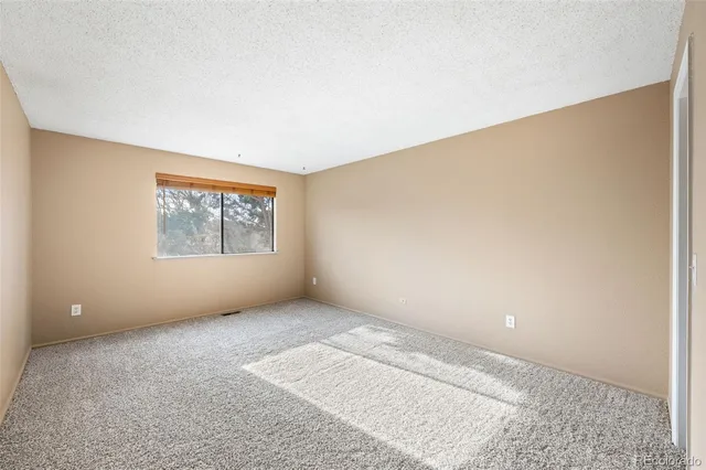 a view of a hallway with closet