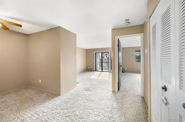 a view of kitchen with windows and refrigerator