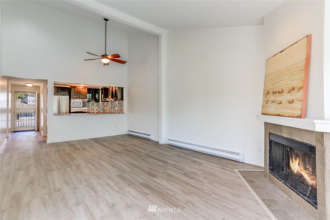 2515 Northeast 4th Street, Unit 531 Renton, WA 98056 - Photo 13 of 28 an empty room with windows and fireplace