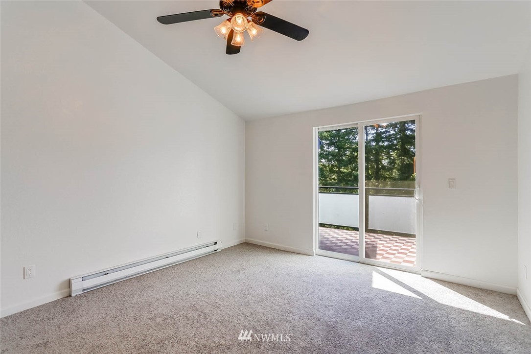 2515 Northeast 4th Street, Unit 531 Renton, WA 98056 - Photo 17 of 28 an empty room with a empty space and a ceiling fan
