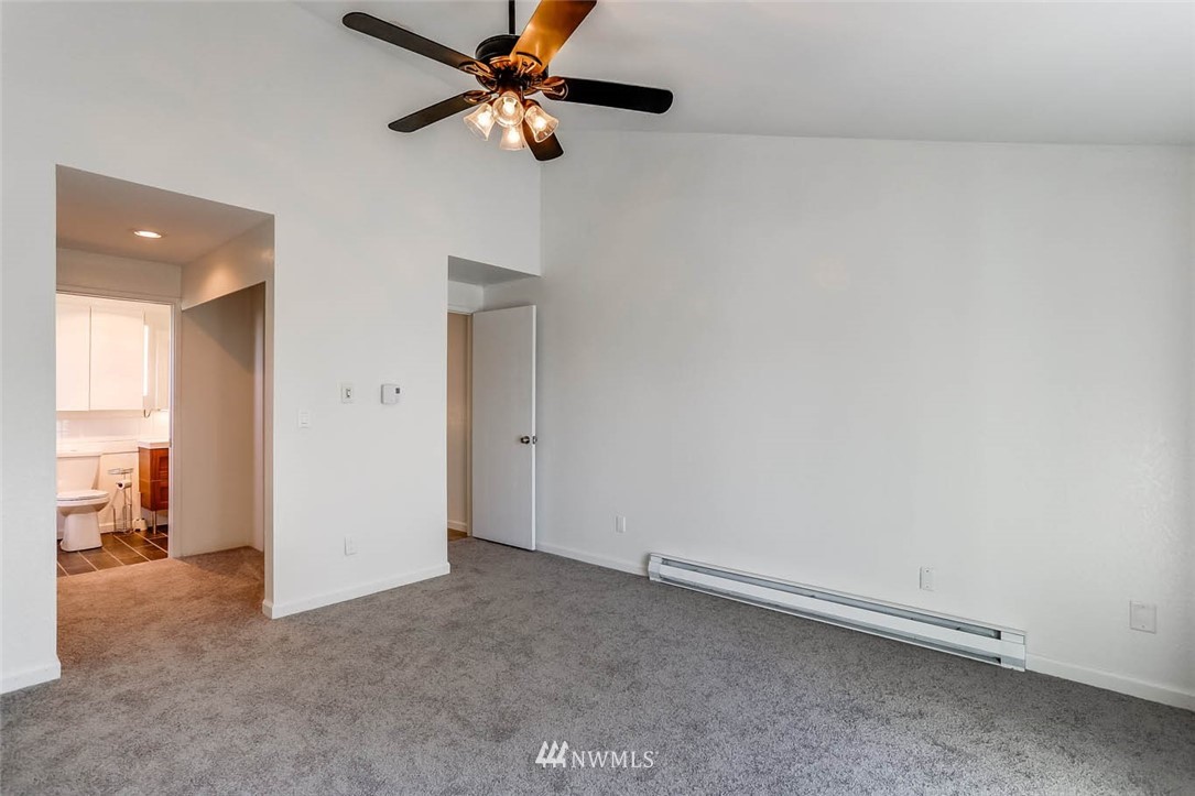 2515 Northeast 4th Street, Unit 531 Renton, WA 98056 - Photo 18 of 28 an empty room with closet and a ceiling fan