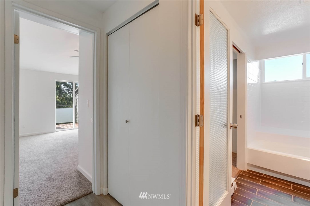 2515 Northeast 4th Street, Unit 531 Renton, WA 98056 - Photo 23 of 28 a view of a bathroom with a glass door