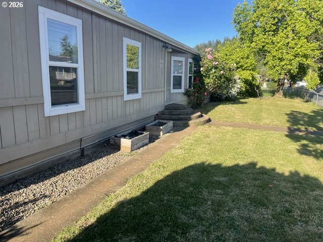 5660 Daisy Street, Unit 31 Springfield, OR 97478 - Photo 7 of 44 a view of a house with a yard