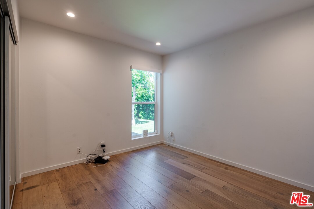 4518 Alla Road Los Angeles, CA 90066 - Photo 11 of 23 an empty room with wooden floor and windows
