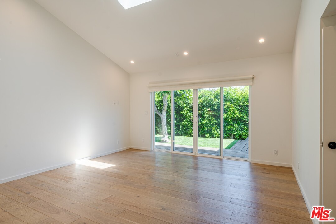 4518 Alla Road Los Angeles, CA 90066 - Photo 14 of 23 a view of an empty room with wooden floor and a window