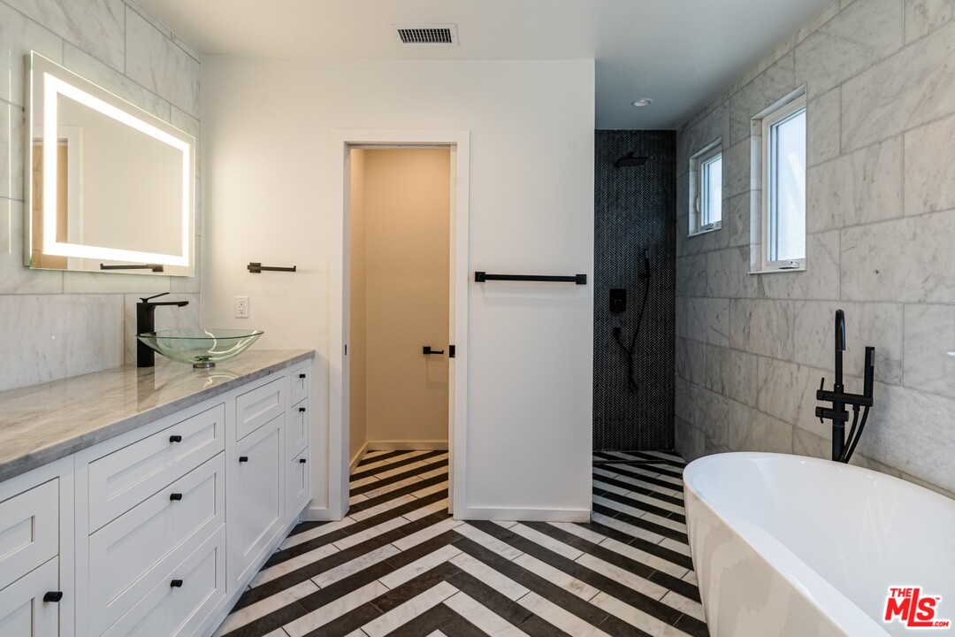 4518 Alla Road Los Angeles, CA 90066 - Photo 16 of 23 a bathroom with a sink a toilet and shower