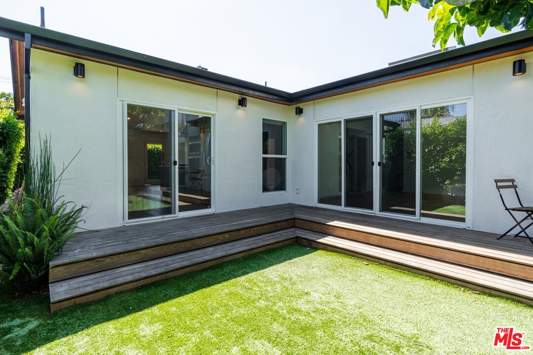 4518 Alla Road Los Angeles, CA 90066 - Photo 21 of 23 a view of a backyard with a large pool and wooden bench