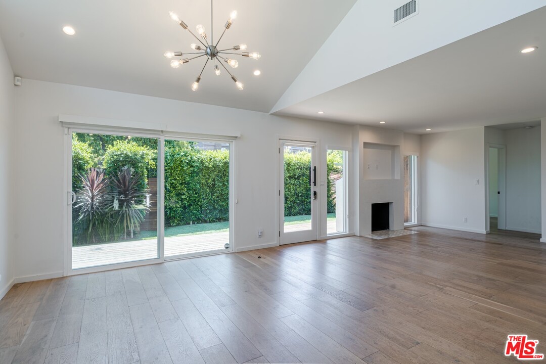 4518 Alla Road Los Angeles, CA 90066 - Photo 6 of 23 a view of an empty room with a window and wooden floor