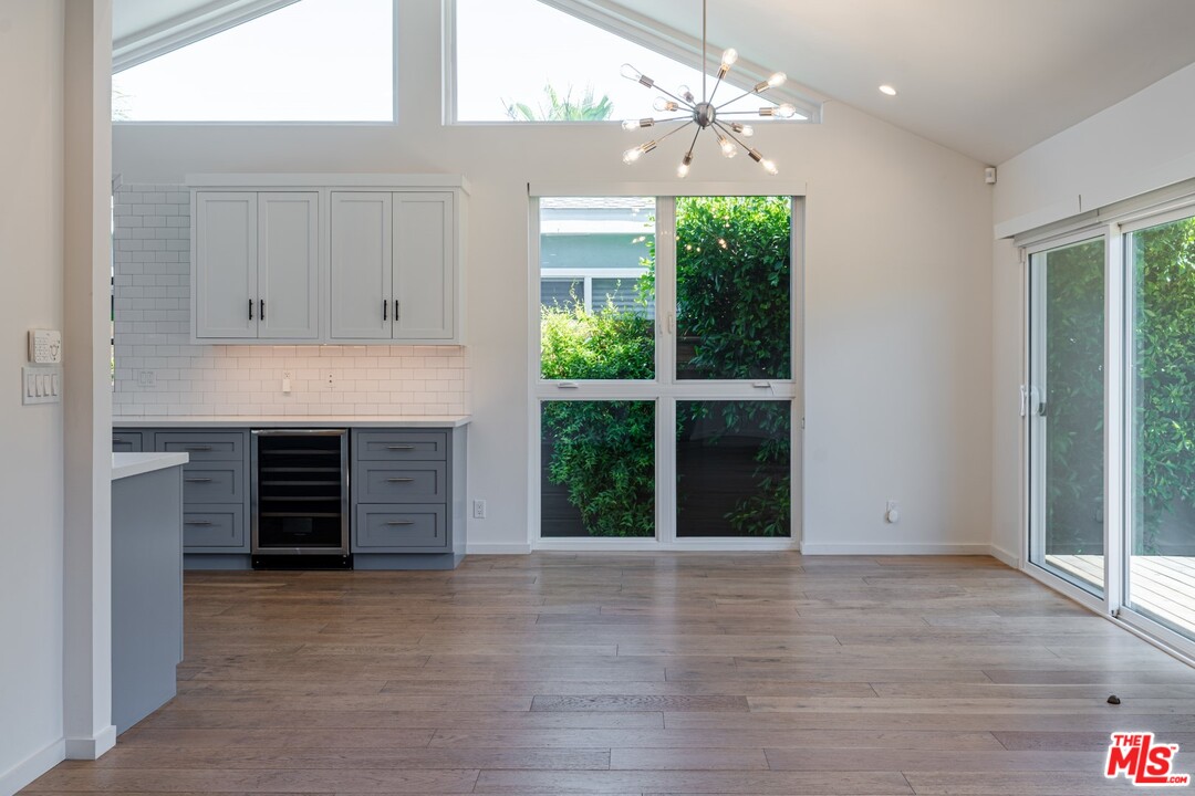 4518 Alla Road Los Angeles, CA 90066 - Photo 8 of 23 an empty room with a fireplace and wooden floor
