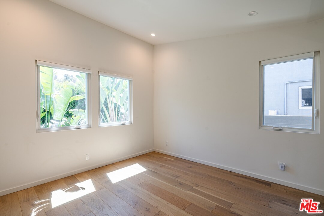 4518 Alla Road Los Angeles, CA 90066 - Photo 9 of 23 a view of an empty room with wooden floor and a window