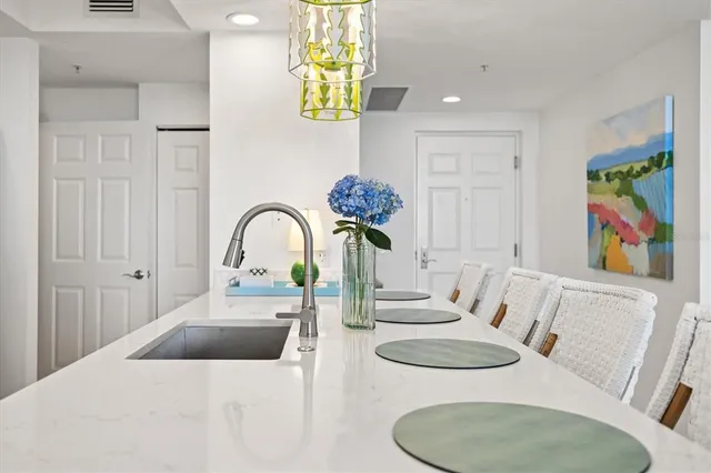 a bathroom with a tub a sink and a mirror