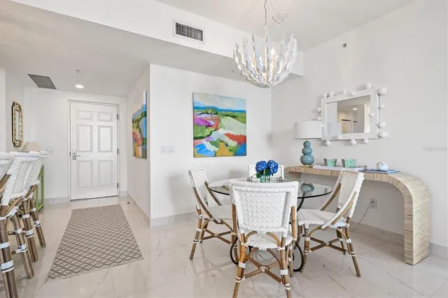 a bedroom with a bed and a lamp