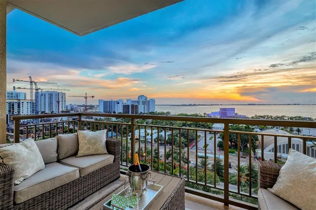 a kitchen with stainless steel appliances kitchen island granite countertop a refrigerator and a stove top oven