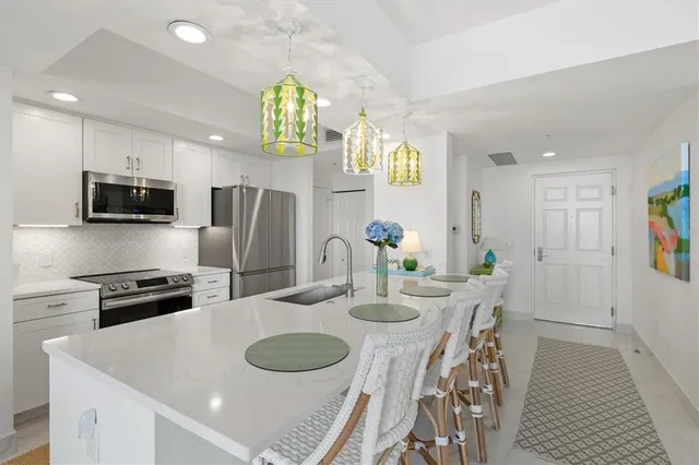 a living room with furniture and a baby crib