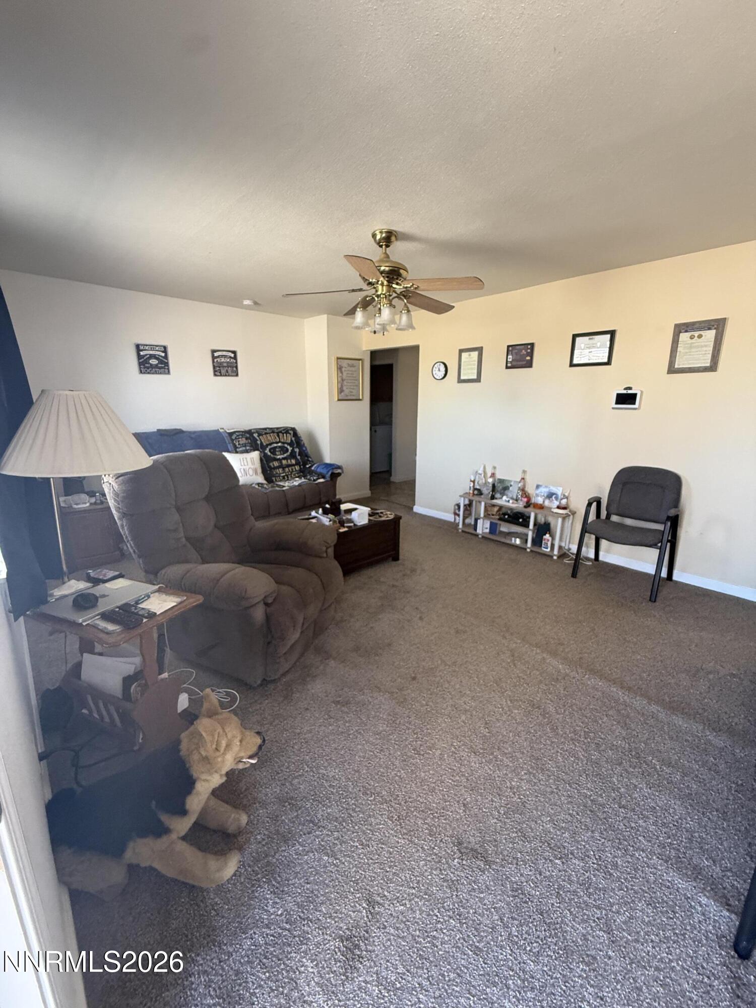 5424 Desert Hills Loop Fallon, NV 89406 - Photo 15 of 21 a living room with furniture and a lamp