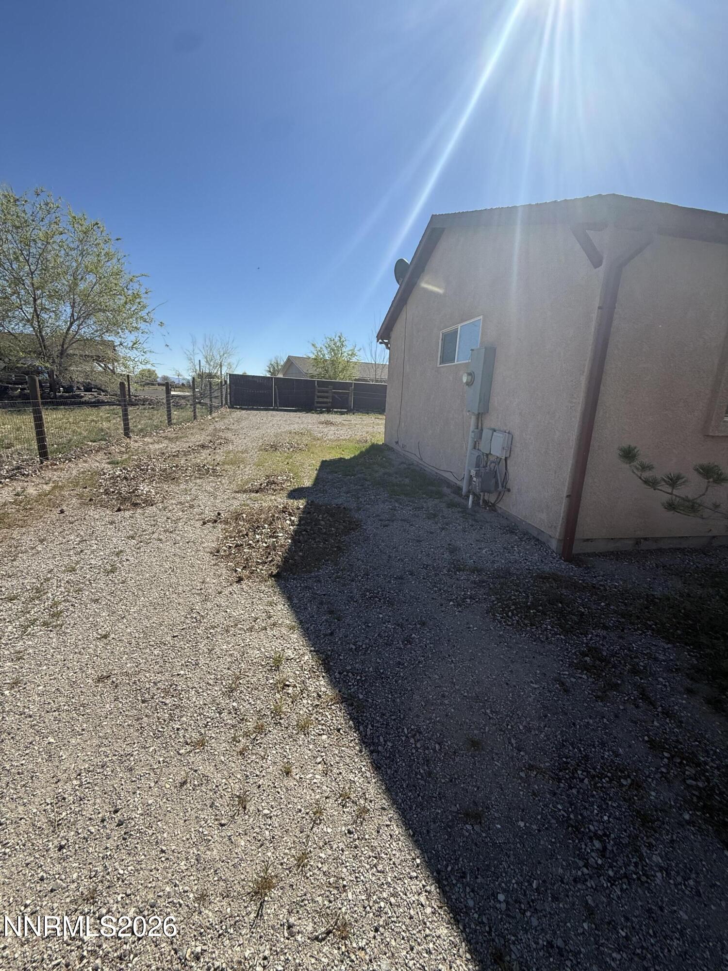5424 Desert Hills Loop Fallon, NV 89406 - Photo 16 of 21 a view of a dry yard with trees