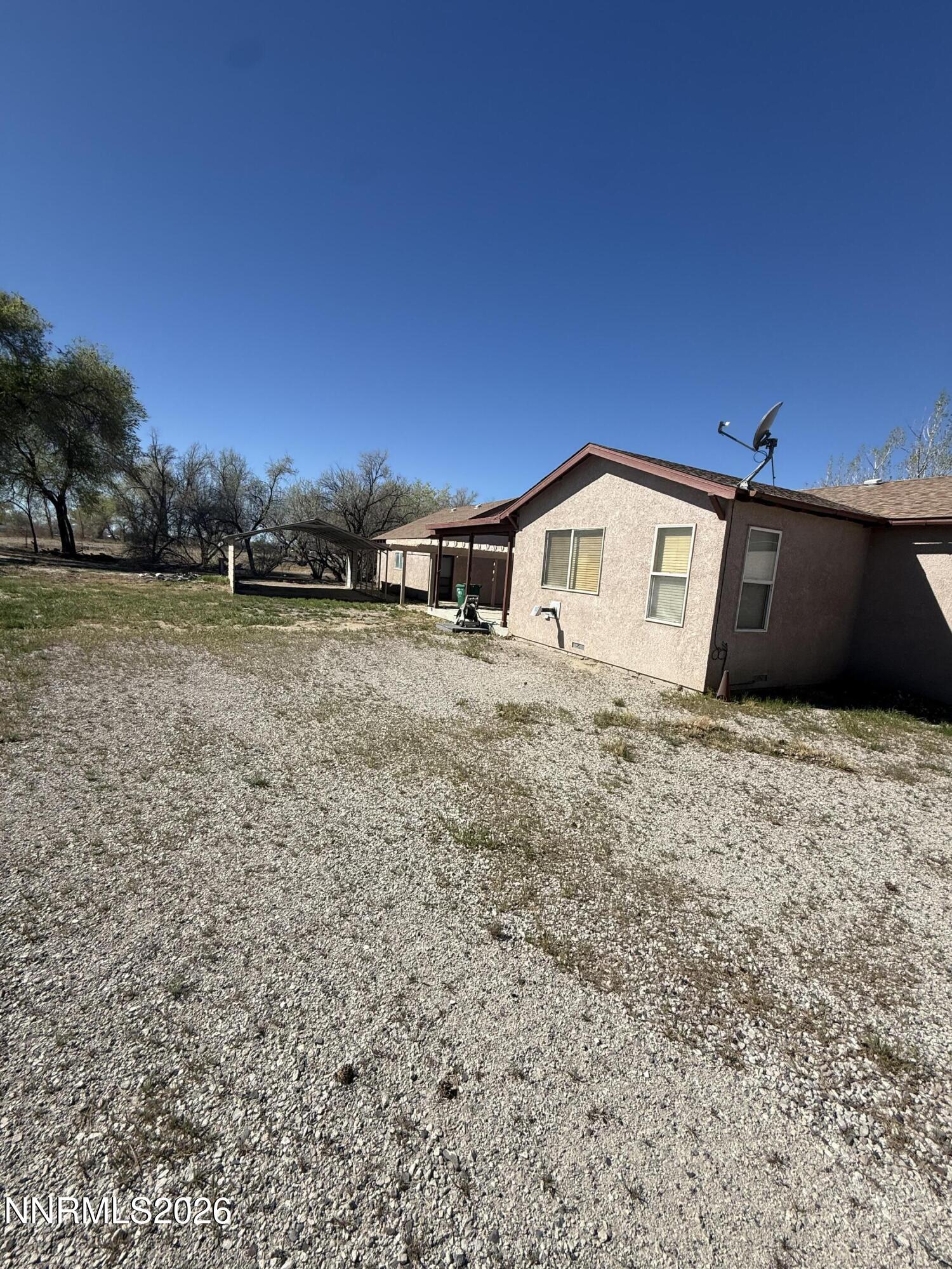 5424 Desert Hills Loop Fallon, NV 89406 - Photo 18 of 21 a view of a house with a yard