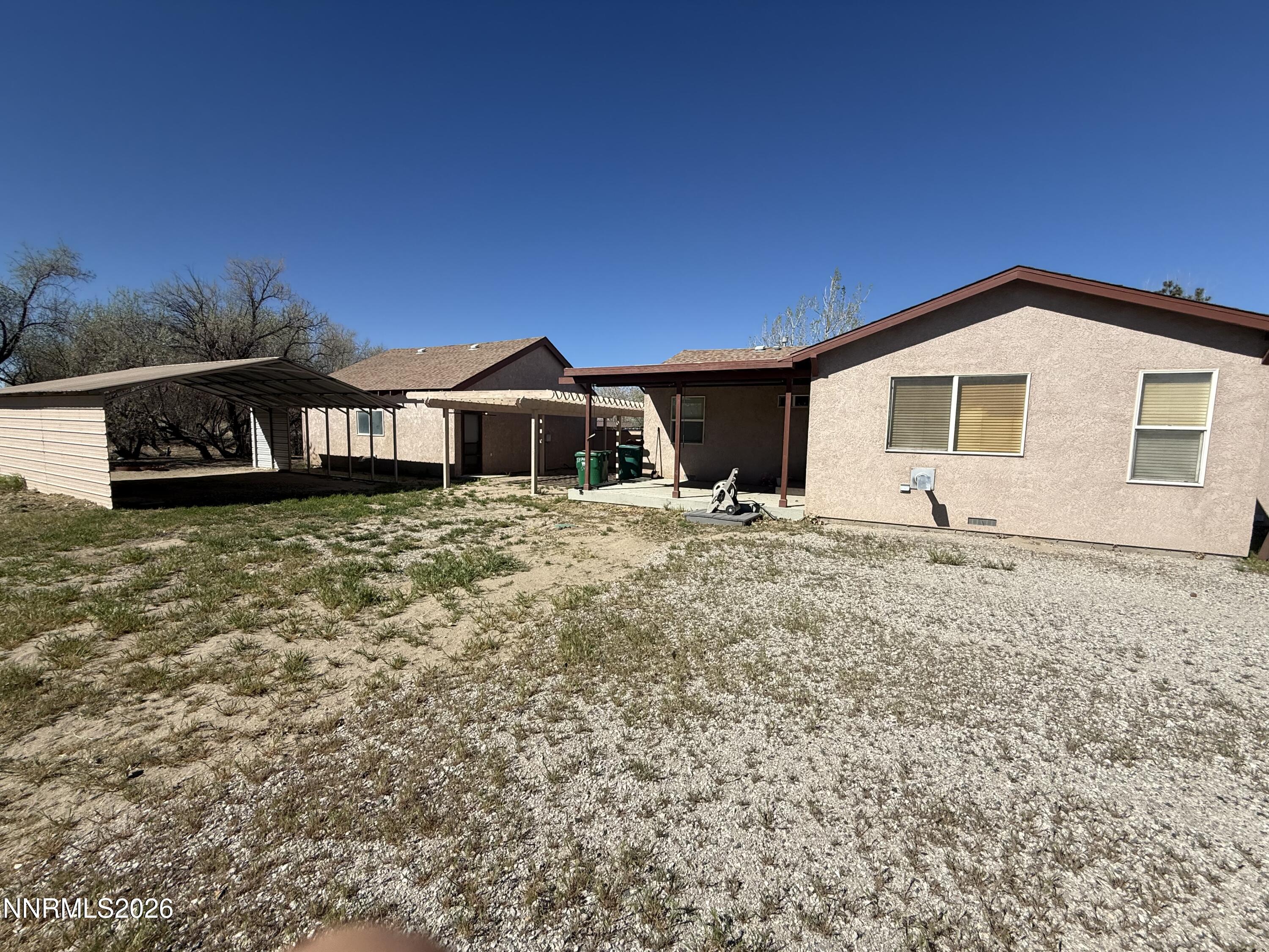5424 Desert Hills Loop Fallon, NV 89406 - Photo 19 of 21 a view of a house with a yard
